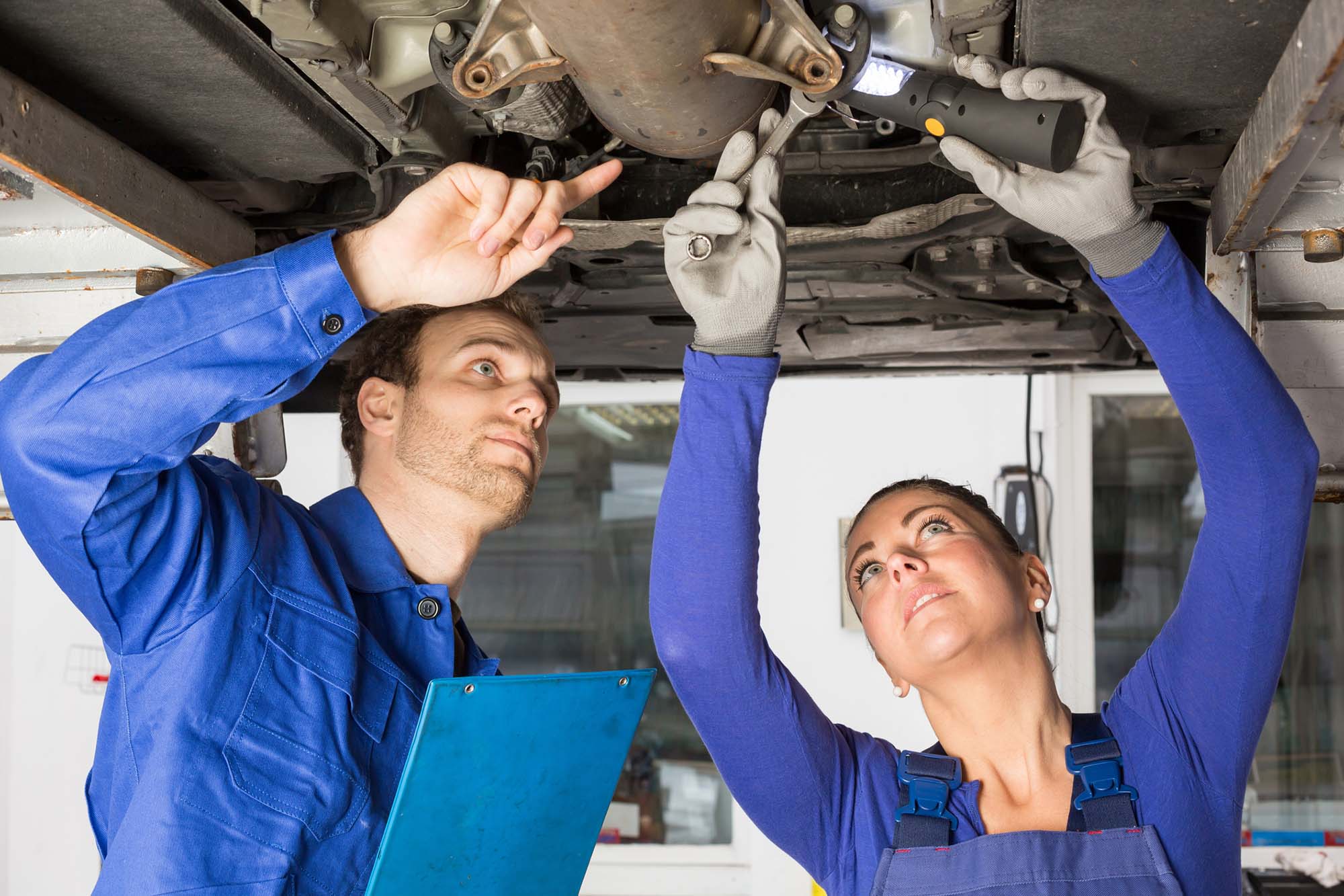 Professional car mechanic working in auto repair service.